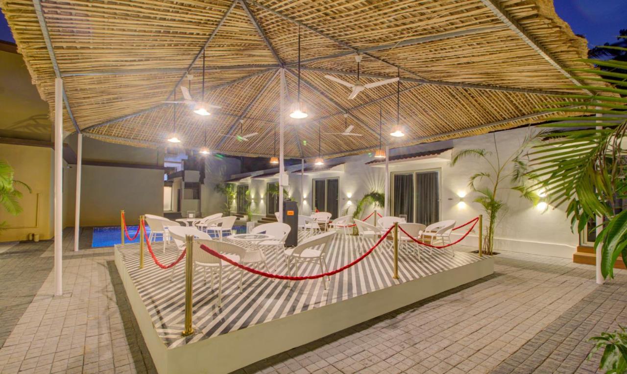 Treebo Code Red Hotel Morjim Exterior photo